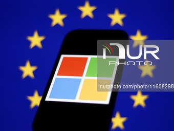 European Union flag displayed on a laptop screen and Microsoft logo displayed on a phone screen are seen in this illustration photo taken in...