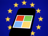 European Union flag displayed on a laptop screen and Microsoft logo displayed on a phone screen are seen in this illustration photo taken in...