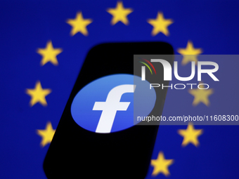 European Union flag displayed on a laptop screen and Facebook logo displayed on a phone screen are seen in this illustration photo taken in...