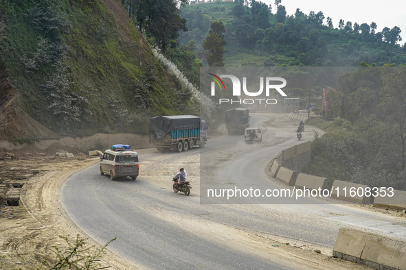 Due to the expansion of Prithvi Highway, passengers suffer from dust pollution while traveling on Prithvi Highway in Dhading, Nepal, on Sept...