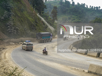 Due to the expansion of Prithvi Highway, passengers suffer from dust pollution while traveling on Prithvi Highway in Dhading, Nepal, on Sept...