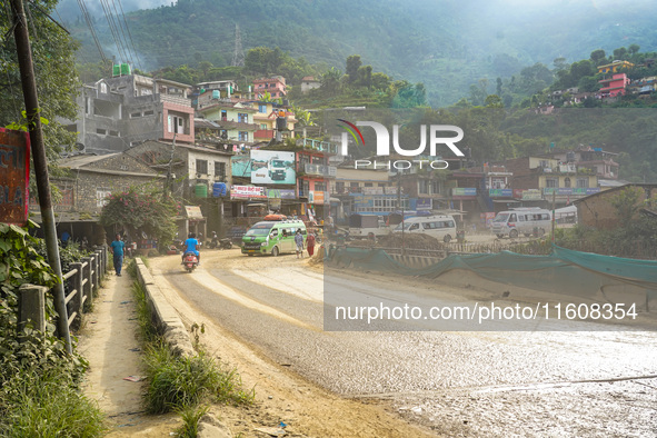 Due to the expansion of Prithvi Highway, passengers suffer from dust pollution while traveling on Prithvi Highway in Dhading, Nepal, on Sept...