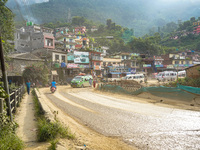 Due to the expansion of Prithvi Highway, passengers suffer from dust pollution while traveling on Prithvi Highway in Dhading, Nepal, on Sept...