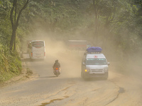 Due to the expansion of Prithvi Highway, passengers suffer from dust pollution while traveling on Prithvi Highway in Dhading, Nepal, on Sept...