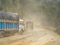 Due to the expansion of Prithvi Highway, passengers suffer from dust pollution while traveling on Prithvi Highway in Dhading, Nepal, on Sept...