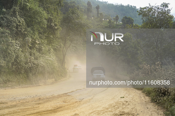 Due to the expansion of Prithvi Highway, passengers suffer from dust pollution while traveling on Prithvi Highway in Dhading, Nepal, on Sept...