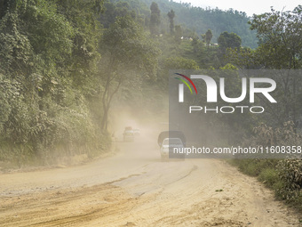 Due to the expansion of Prithvi Highway, passengers suffer from dust pollution while traveling on Prithvi Highway in Dhading, Nepal, on Sept...