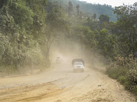 Due to the expansion of Prithvi Highway, passengers suffer from dust pollution while traveling on Prithvi Highway in Dhading, Nepal, on Sept...