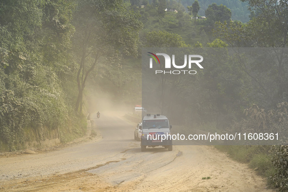 Due to the expansion of Prithvi Highway, passengers suffer from dust pollution while traveling on Prithvi Highway in Dhading, Nepal, on Sept...