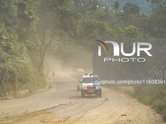 Due to the expansion of Prithvi Highway, passengers suffer from dust pollution while traveling on Prithvi Highway in Dhading, Nepal, on Sept...