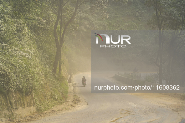 Due to the expansion of Prithvi Highway, passengers suffer from dust pollution while traveling on Prithvi Highway in Dhading, Nepal, on Sept...