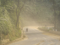 Due to the expansion of Prithvi Highway, passengers suffer from dust pollution while traveling on Prithvi Highway in Dhading, Nepal, on Sept...