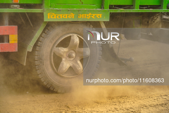 Due to the expansion of Prithvi Highway, passengers suffer from dust pollution while traveling on Prithvi Highway in Dhading, Nepal, on Sept...