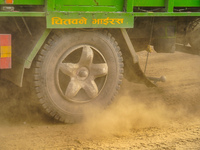 Due to the expansion of Prithvi Highway, passengers suffer from dust pollution while traveling on Prithvi Highway in Dhading, Nepal, on Sept...