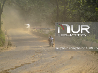 Due to the expansion of Prithvi Highway, passengers suffer from dust pollution while traveling on Prithvi Highway in Dhading, Nepal, on Sept...