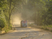 Due to the expansion of Prithvi Highway, passengers suffer from dust pollution while traveling on Prithvi Highway in Dhading, Nepal, on Sept...