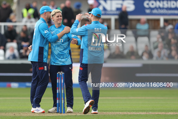 England's Jacob Bethell (center) celebrates taking the wicket of Australia's Cameron Green during the Metro Bank One Day Series match betwee...