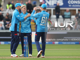 England's Jacob Bethell (center) celebrates taking the wicket of Australia's Cameron Green during the Metro Bank One Day Series match betwee...