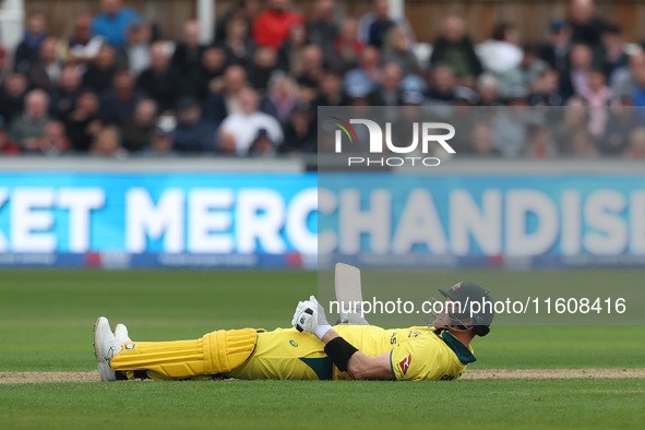 Australia's Steve Smith lies on the turf after overbalancing while trying to execute a ramp shot during the Metro Bank One Day Series match...