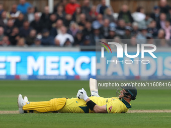 Australia's Steve Smith lies on the turf after overbalancing while trying to execute a ramp shot during the Metro Bank One Day Series match...