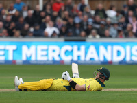 Australia's Steve Smith lies on the turf after overbalancing while trying to execute a ramp shot during the Metro Bank One Day Series match...