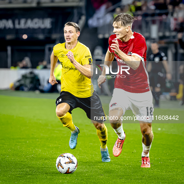 Elfsborg midfielder Simon Hedlund and AZ Alkmaar defender David Moller Wolfe during the match AZ - Elfsborg at the AZ Stadium for the UEFA E...