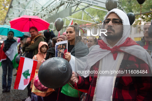 A hundred pro-Palestinian activists gather to protest against Israeli attacks on Lebanon and Gaza in Bonn, Germany, on September 25, 2024. 