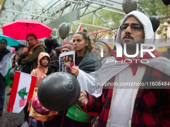 A hundred pro-Palestinian activists gather to protest against Israeli attacks on Lebanon and Gaza in Bonn, Germany, on September 25, 2024. (