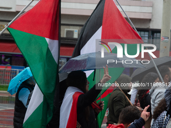 A hundred pro-Palestinian activists gather to protest against Israeli attacks on Lebanon and Gaza in Bonn, Germany, on September 25, 2024. (