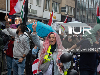 A hundred pro-Palestinian activists gather to protest against Israeli attacks on Lebanon and Gaza in Bonn, Germany, on September 25, 2024. (