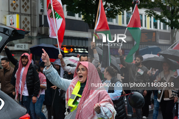 A hundred pro-Palestinian activists gather to protest against Israeli attacks on Lebanon and Gaza in Bonn, Germany, on September 25, 2024. 