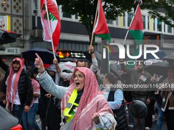 A hundred pro-Palestinian activists gather to protest against Israeli attacks on Lebanon and Gaza in Bonn, Germany, on September 25, 2024. (