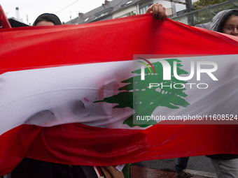 A hundred pro-Palestinian activists gather to protest against Israeli attacks on Lebanon and Gaza in Bonn, Germany, on September 25, 2024. (