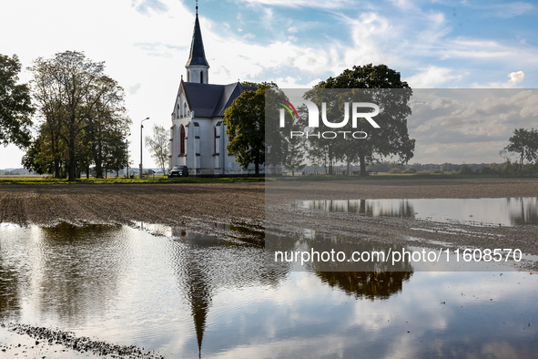 A church is seen by a flooded agricultural field on September 25, 2024 near Nysa as massive flooding affected large agricultural areas in so...