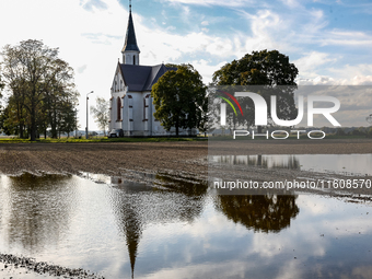 A church is seen by a flooded agricultural field on September 25, 2024 near Nysa as massive flooding affected large agricultural areas in so...