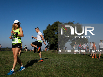 Competitors prepare for the race during the 17th PKO Three Mounds Run on the Krakus Mound in Krakow, Poland, on September 22, 2024. The Thre...