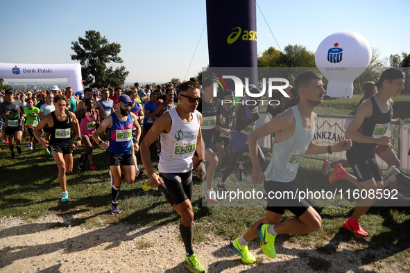 Competitors run during the 17th PKO Three Mounds Run on the Krakus Mound in Krakow, Poland, on September 22, 2024. The Three Mounds Run has...