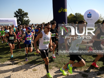 Competitors run during the 17th PKO Three Mounds Run on the Krakus Mound in Krakow, Poland, on September 22, 2024. The Three Mounds Run has...