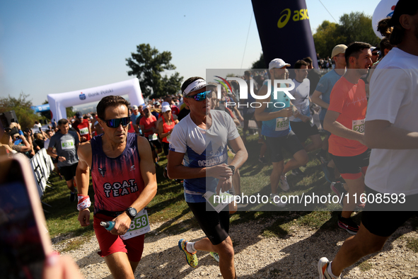 Competitors run during the 17th PKO Three Mounds Run on the Krakus Mound in Krakow, Poland, on September 22, 2024. The Three Mounds Run has...