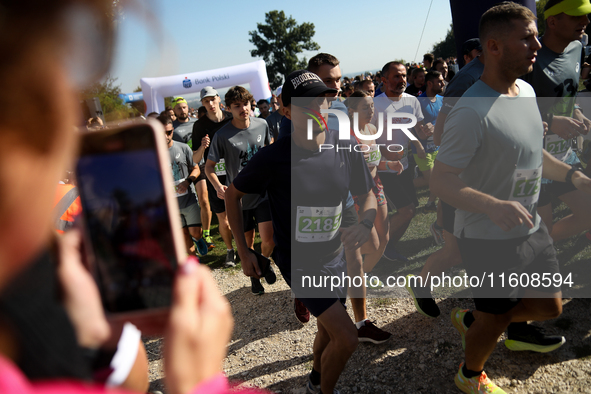 Competitors run during the 17th PKO Three Mounds Run on the Krakus Mound in Krakow, Poland, on September 22, 2024. The Three Mounds Run has...