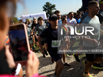 Competitors run during the 17th PKO Three Mounds Run on the Krakus Mound in Krakow, Poland, on September 22, 2024. The Three Mounds Run has...