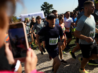 Competitors run during the 17th PKO Three Mounds Run on the Krakus Mound in Krakow, Poland, on September 22, 2024. The Three Mounds Run has...