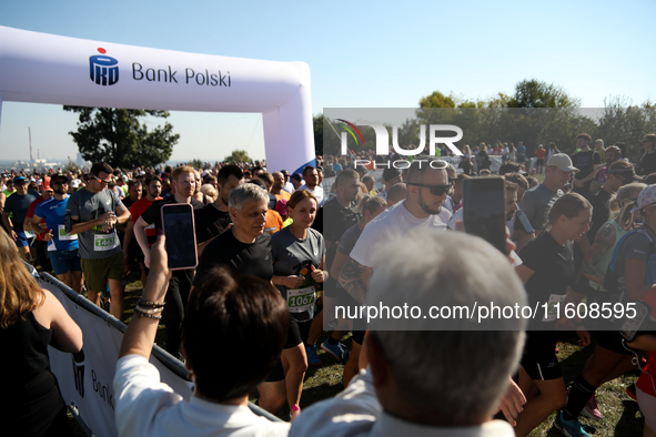 Competitors run during the 17th PKO Three Mounds Run on the Krakus Mound in Krakow, Poland, on September 22, 2024. The Three Mounds Run has...