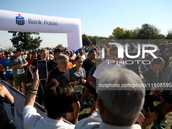 Competitors run during the 17th PKO Three Mounds Run on the Krakus Mound in Krakow, Poland, on September 22, 2024. The Three Mounds Run has...