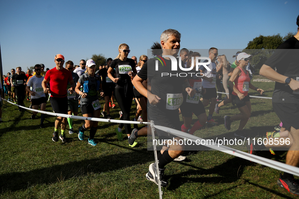 Competitors run during the 17th PKO Three Mounds Run on the Krakus Mound in Krakow, Poland, on September 22, 2024. The Three Mounds Run has...