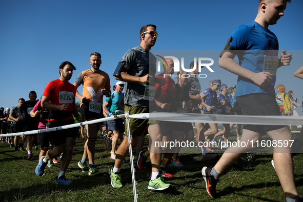 Competitors run during the 17th PKO Three Mounds Run on the Krakus Mound in Krakow, Poland, on September 22, 2024. The Three Mounds Run has...