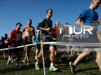 Competitors run during the 17th PKO Three Mounds Run on the Krakus Mound in Krakow, Poland, on September 22, 2024. The Three Mounds Run has...