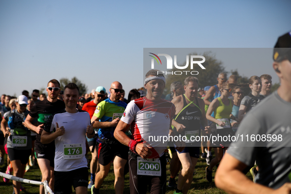 Competitors run during the 17th PKO Three Mounds Run on the Krakus Mound in Krakow, Poland, on September 22, 2024. The Three Mounds Run has...