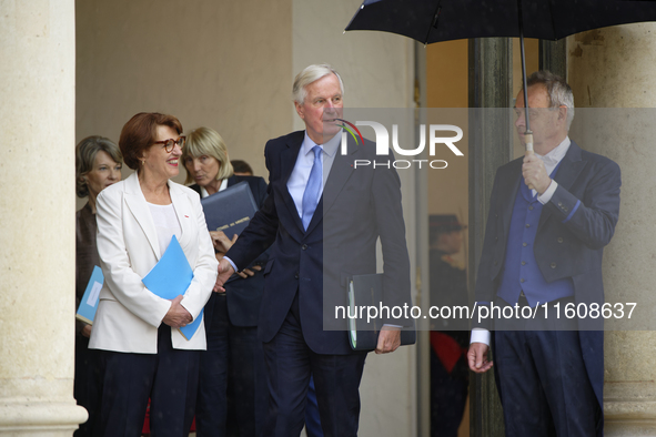 Newly appointed French Minister for Agriculture, Food Sovereignty, and Forestry Annie Genevard (L) and French Prime Minister Michel Barnier...