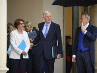 Newly appointed French Minister for Agriculture, Food Sovereignty, and Forestry Annie Genevard (L) and French Prime Minister Michel Barnier...